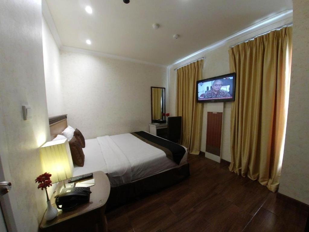Amos Cozy Hotel Melawai Jakarta Buitenkant foto